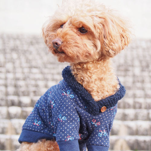 A dog wearing shawl collar tops